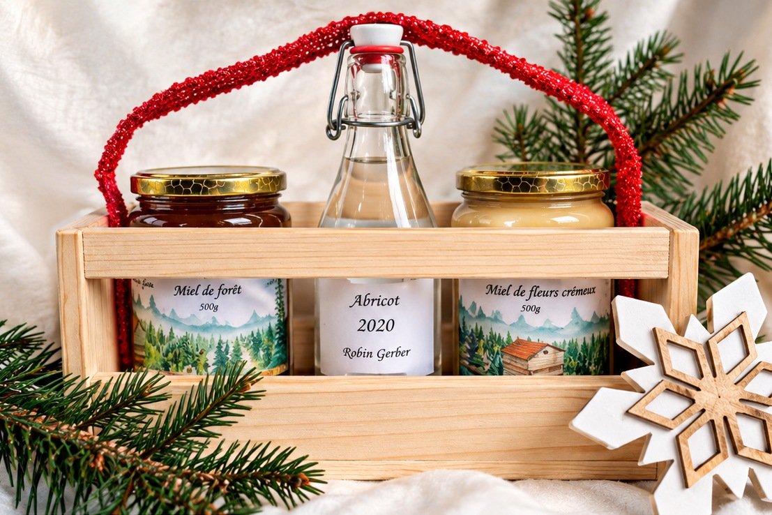 Coffret Signature Robin Gerber : deux miels du Jura 500 g et une eau-de-vie au choix, dans un coffret en bois